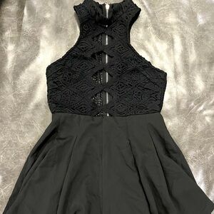 Rumor Romper. NWT. Black. Lace top. Size M